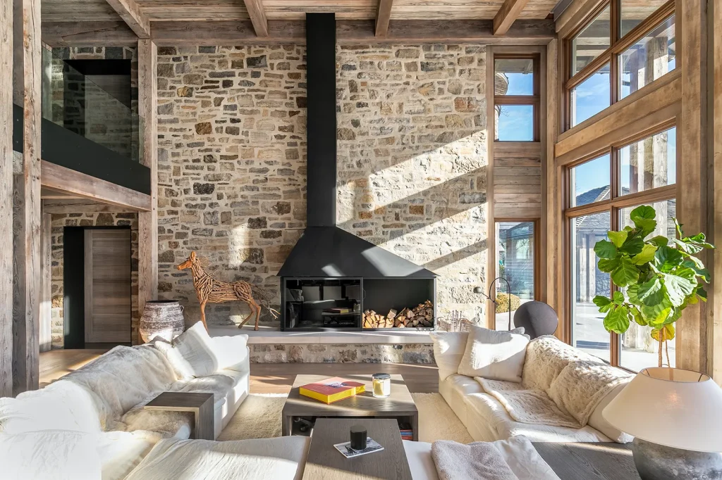 16 Senneville interior design sold 10-million quebec stone wall fireplace wood beams